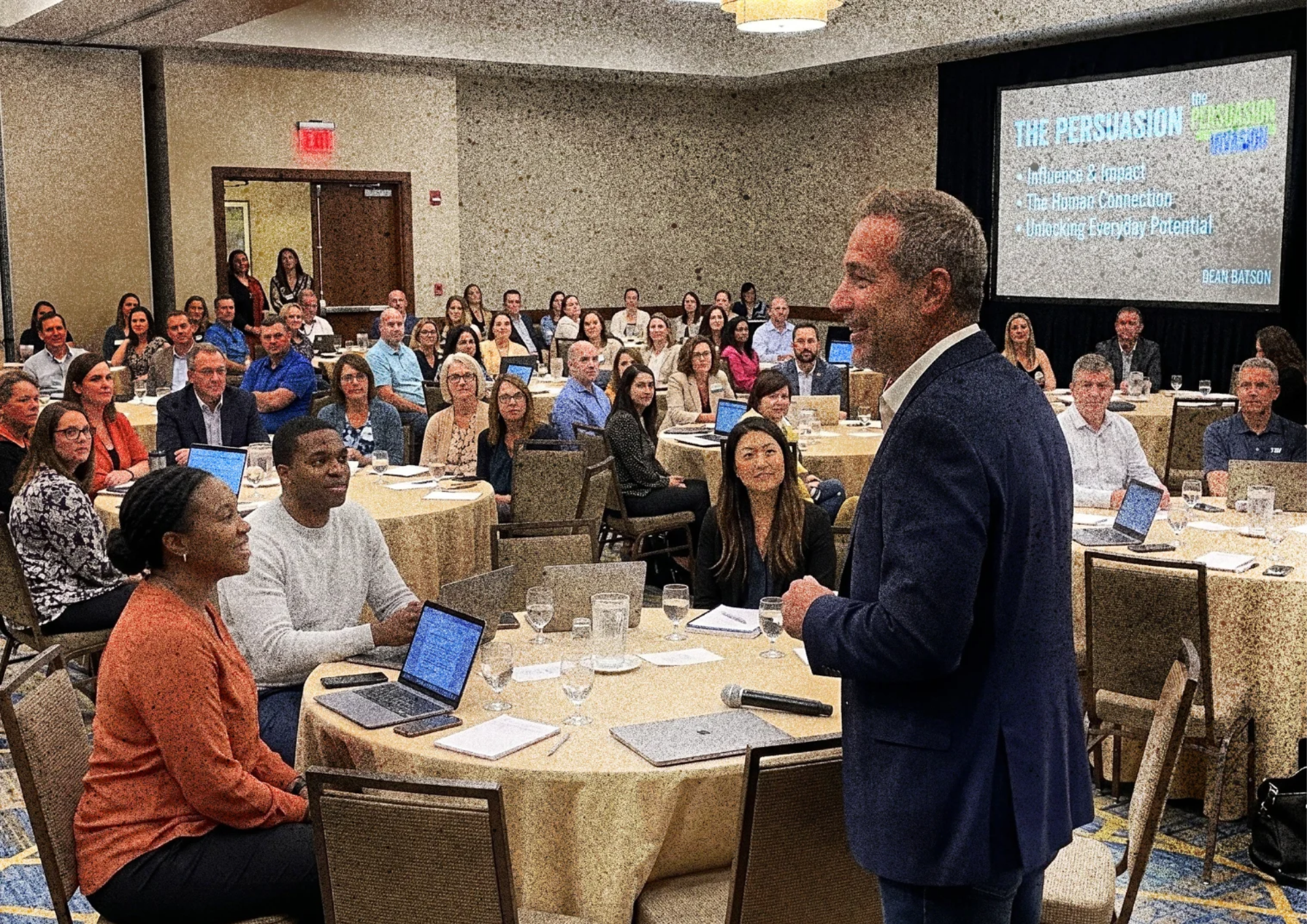 Dean engaging a conference audience